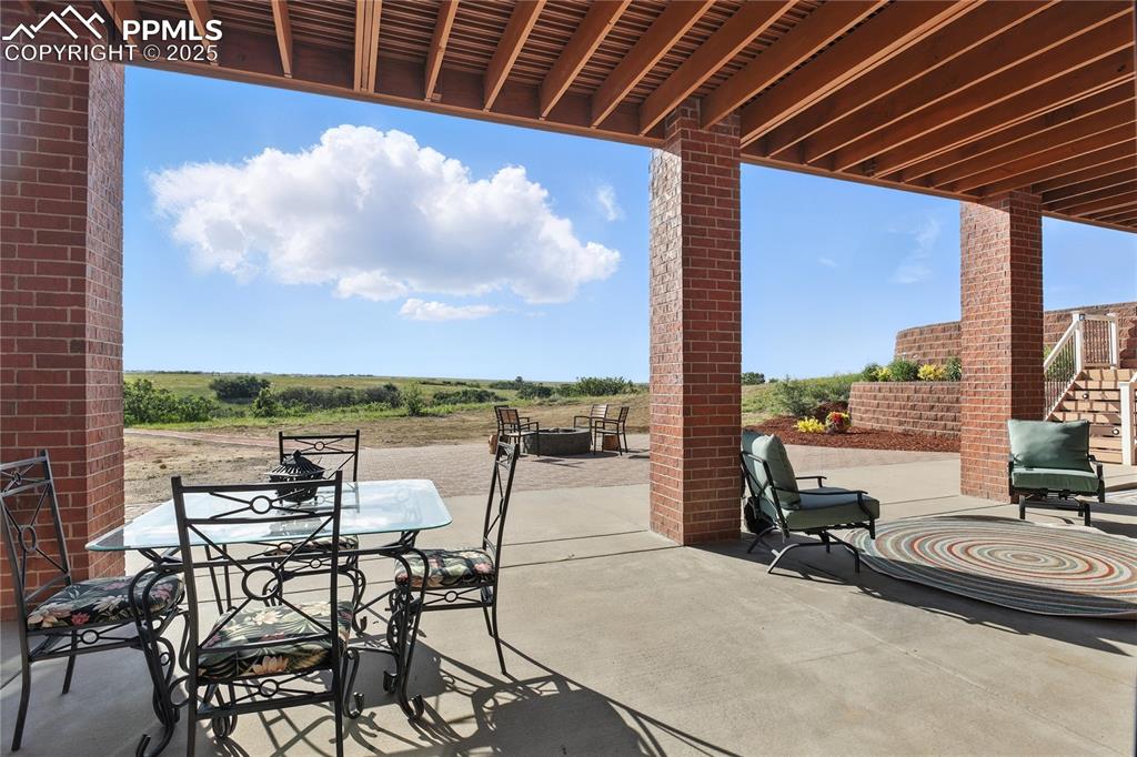 Image 42 of 50: View of patio featuring outdoor dining area