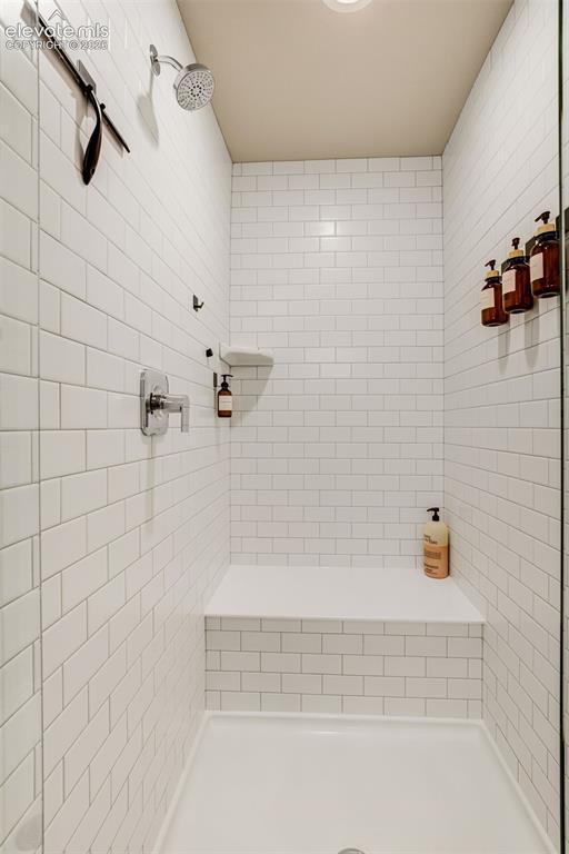 Image 28 of 49: Walk-in shower in the primary bathroom