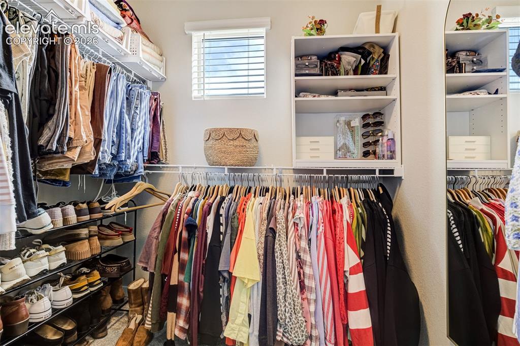 Image 29 of 49: Primary walk-in closet