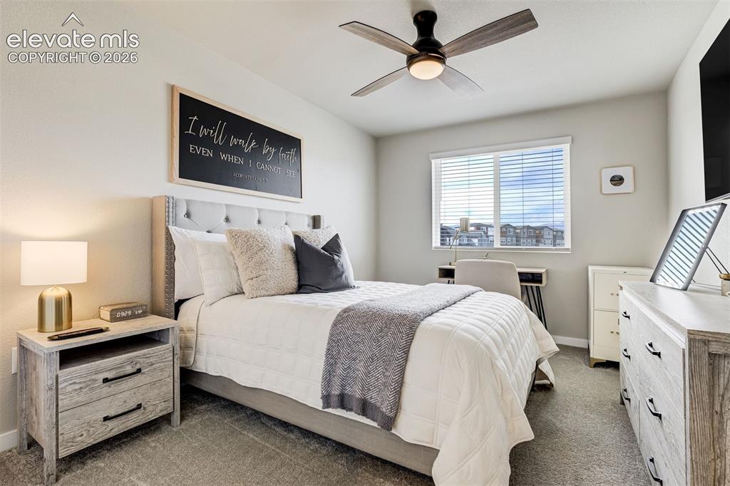 Image 30 of 49: Upstairs bedroom with view of Pikes Peak