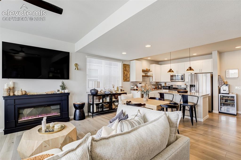 Image 7 of 49: Living room, dining room, and kitchen