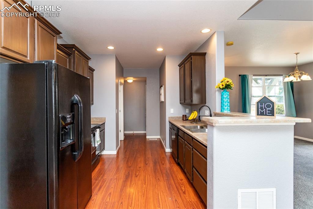 Image 18 of 43: Looking towards door to garage, laundry room, and small pantry on the right