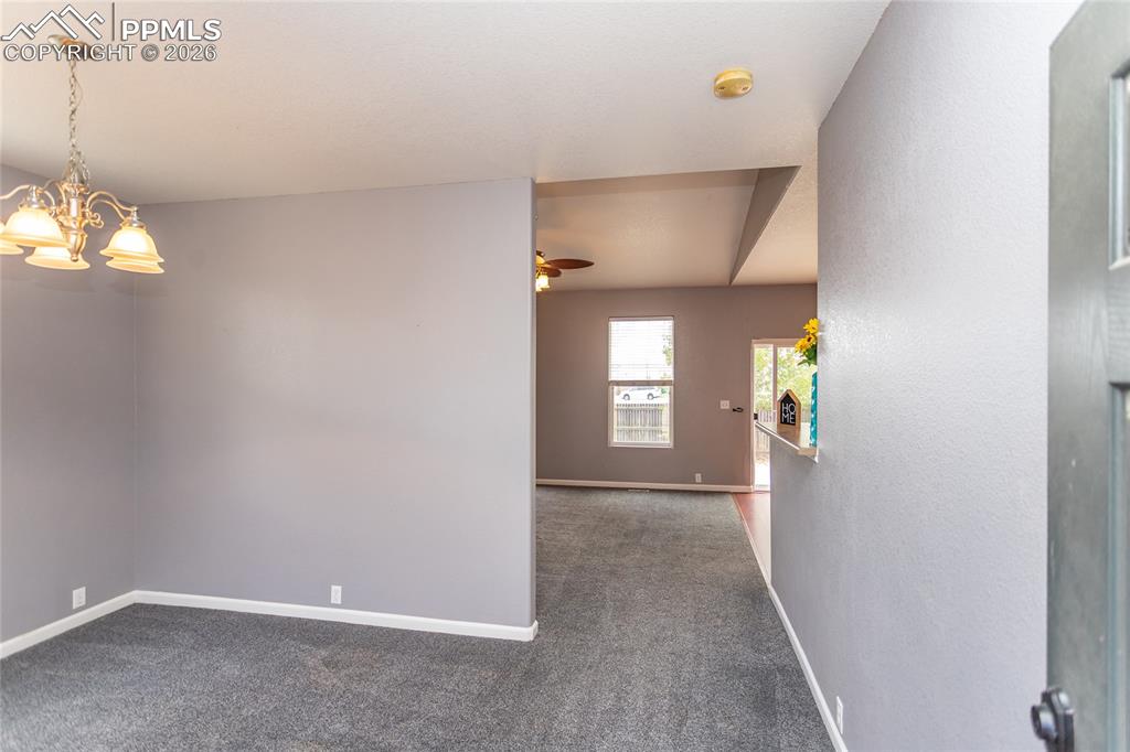 Image 8 of 43: Dining room or office as you walk into the home