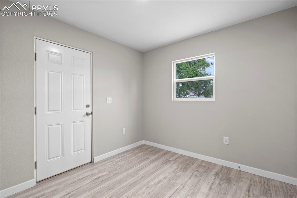 Image 19 of 26: Empty room featuring light wood-style flooring and baseboards