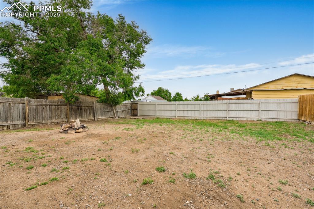 Image 25 of 26: View of fenced backyard
