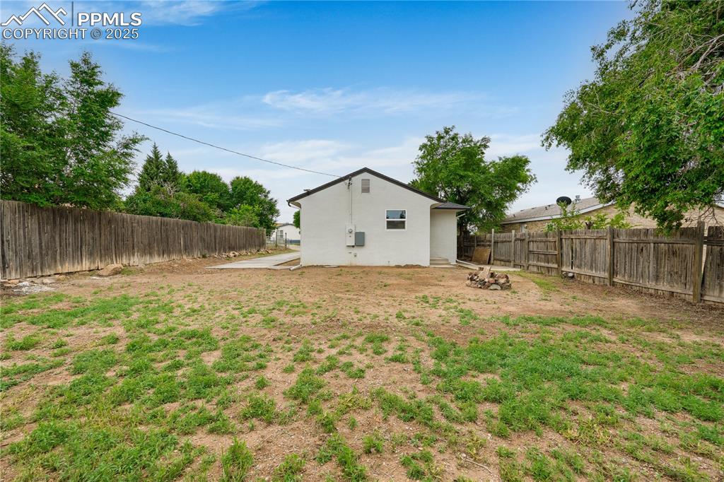 Image 26 of 26: View of fenced backyard