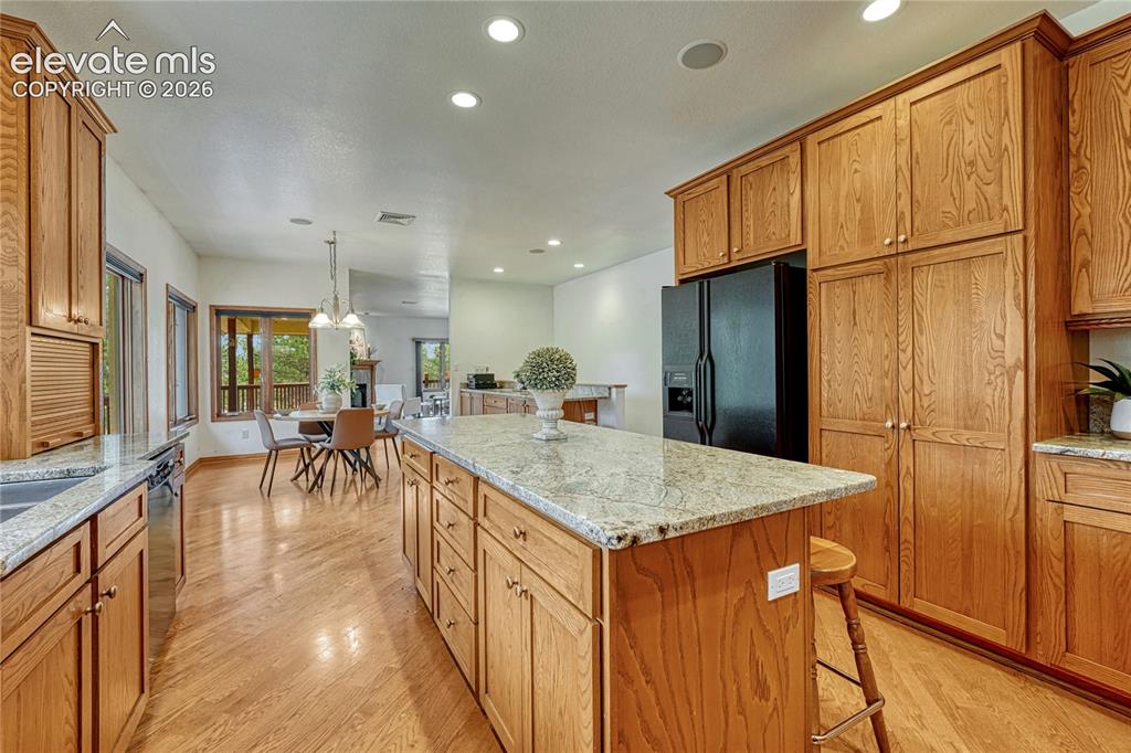 Image 19 of 50: Beautiful wood cabinetry with granite countertops.