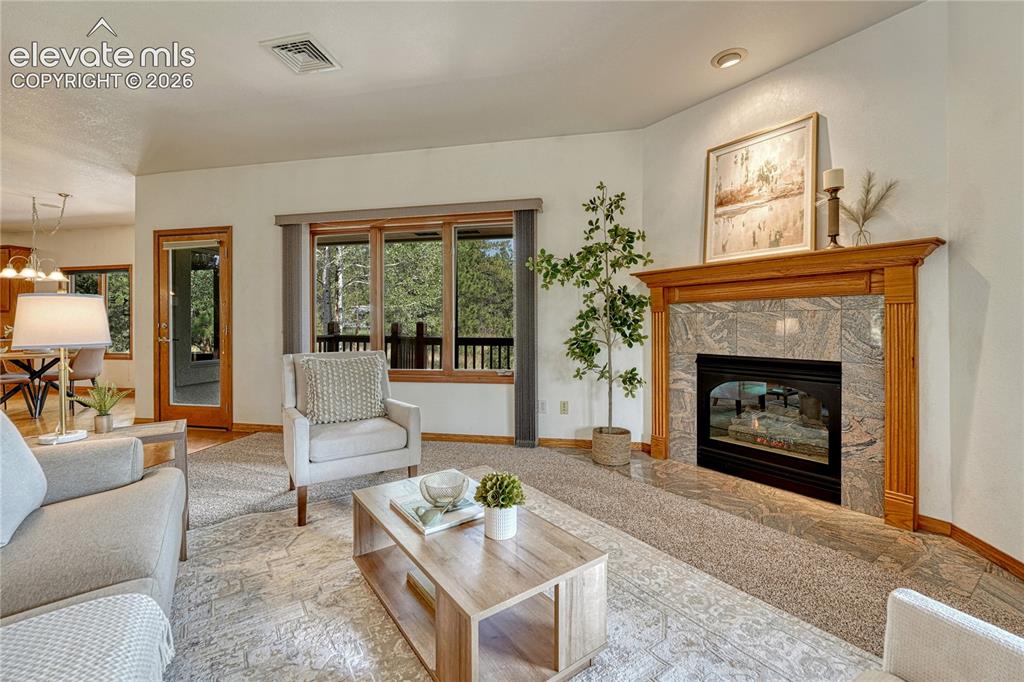 Image 25 of 50: Great Room with welcoming fireplace for chilly Colorado evenings.
