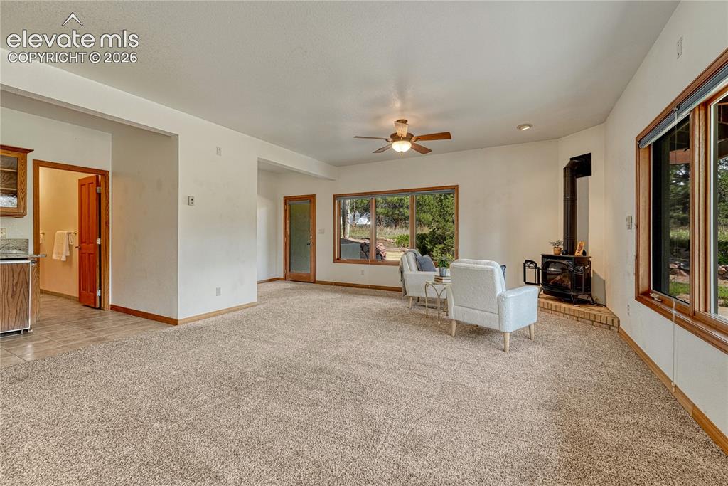 Image 34 of 50: Rec room has room for a pool table and a sitting area.