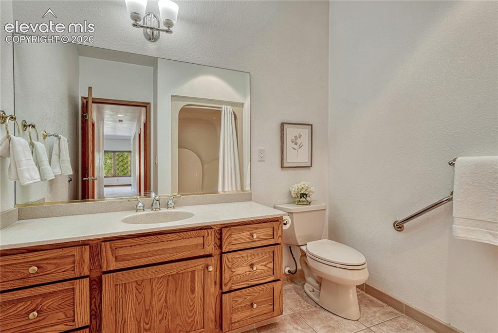 Image 42 of 50: Lower level bath vanity.