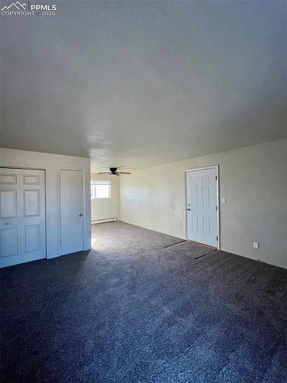 Image 16 of 26: View from living room sliding glass door towards front door & dining area.