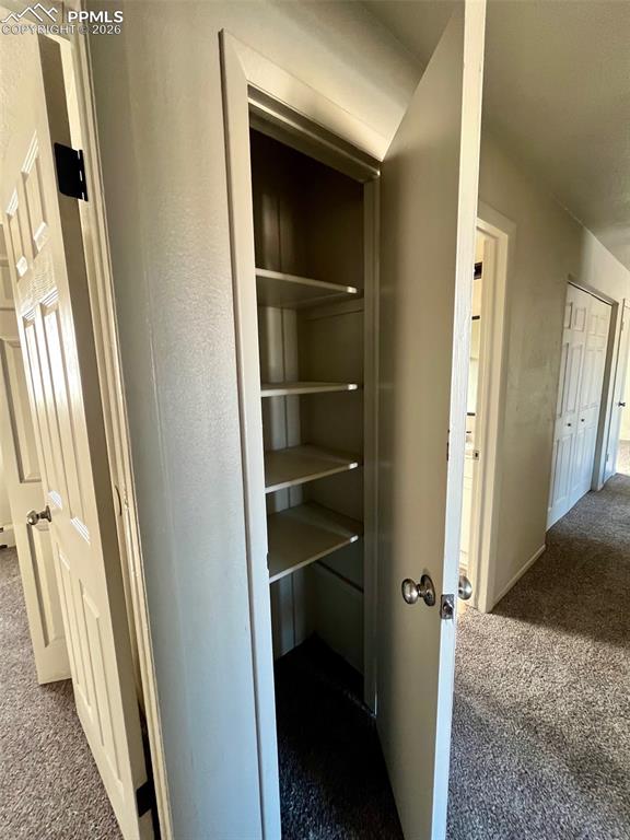 Image 25 of 26: Hallway linen closet.