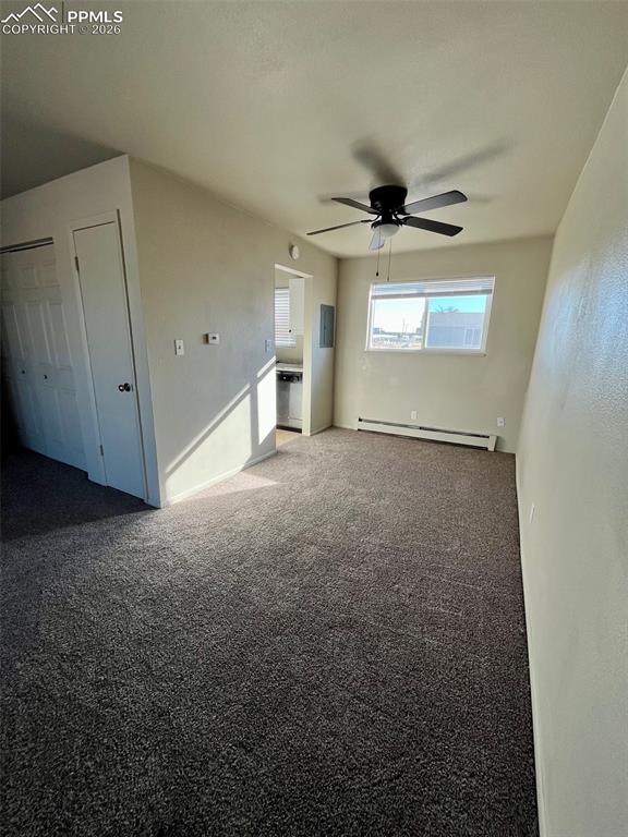 Image 4 of 26: view from front door to dining area and kitchen.