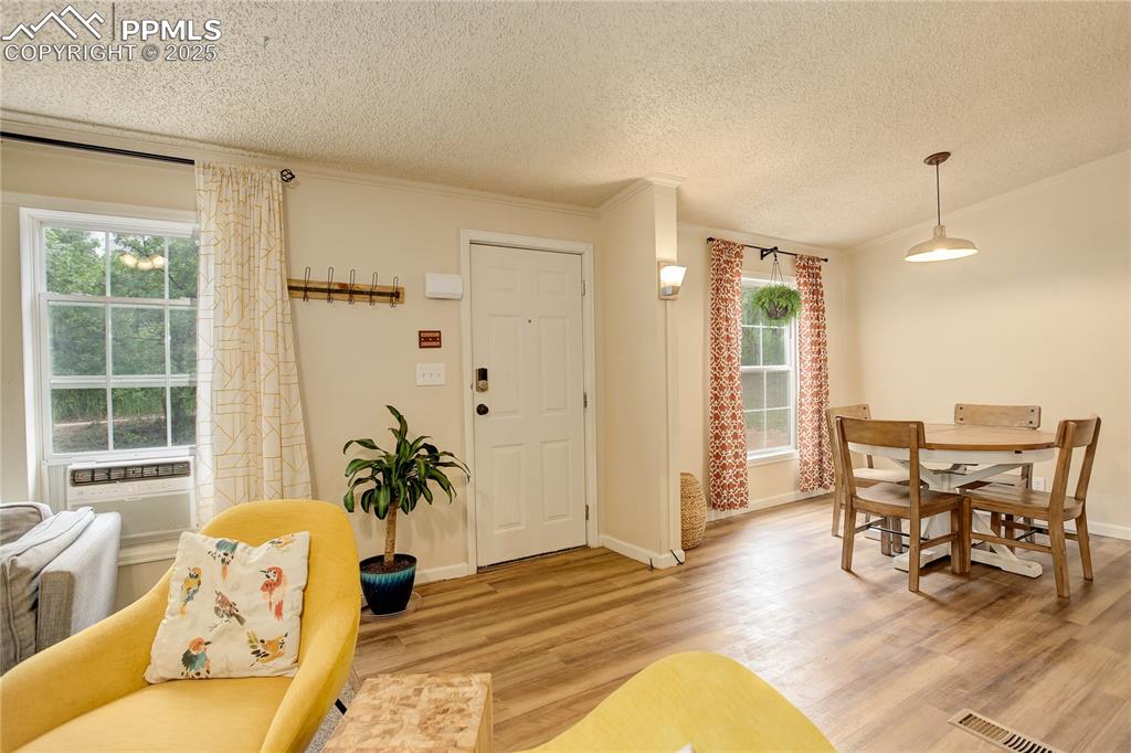 Image 10 of 43: Entry and dining area.