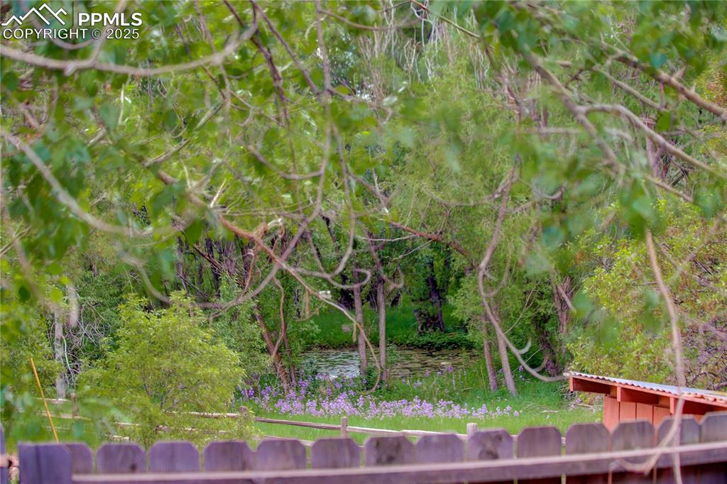Image 29 of 43: Peek-a-boo view from the deck of the neighbor