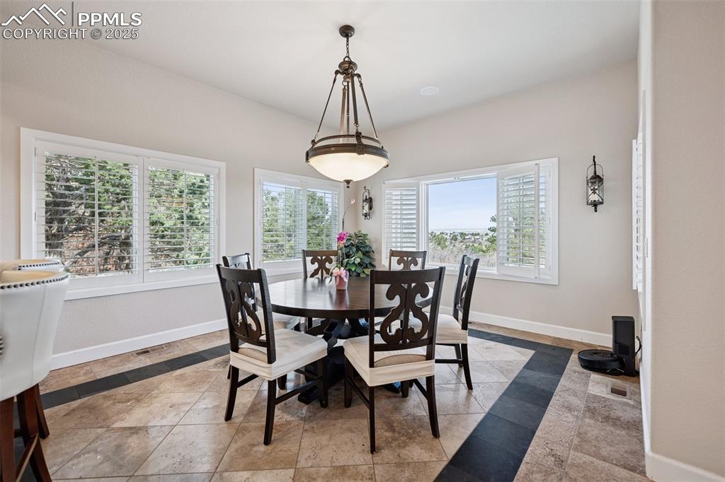 Image 18 of 48: Dining room featuring baseboards and visible vents