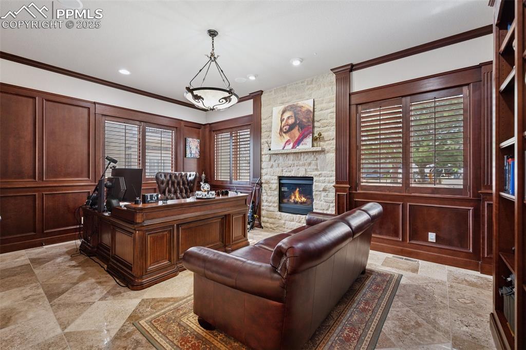 Image 19 of 48: Office area featuring recessed lighting, a decorative wall, a stone firepla