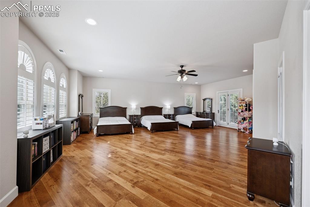 Image 27 of 48: Living room featuring ceiling fan, light wood finished floors, visible vent