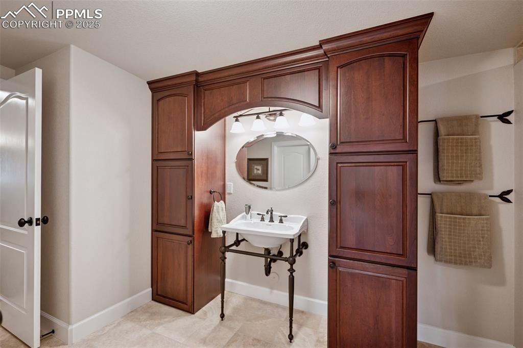 Image 40 of 48: Bathroom featuring baseboards