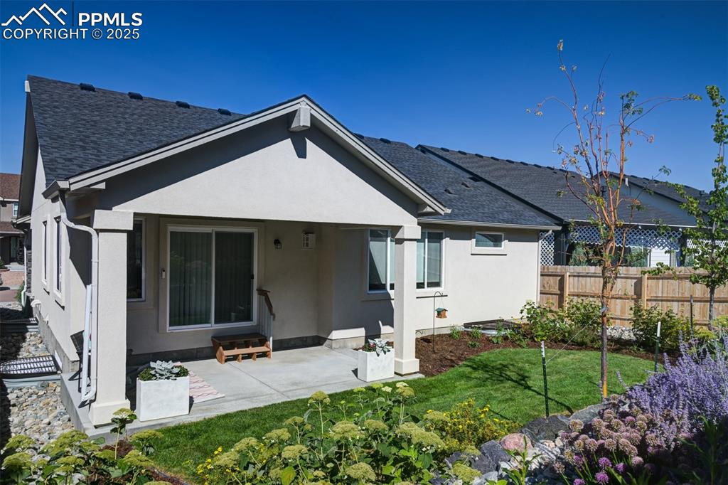 Image 3 of 44: Back of property featuring a patio area and stucco siding