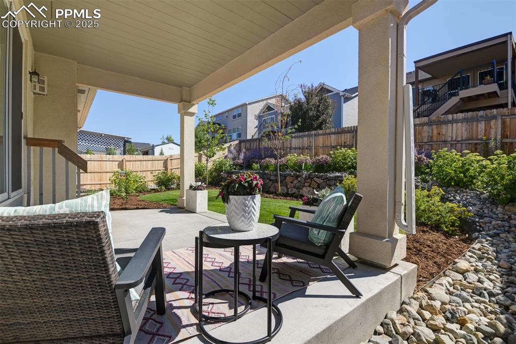 Image 5 of 44: Fenced backyard featuring a patio