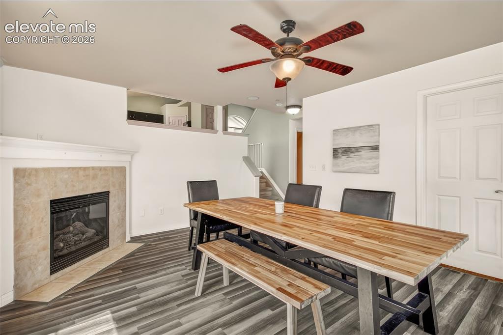 Image 17 of 26: Family room in lower level with fireplace