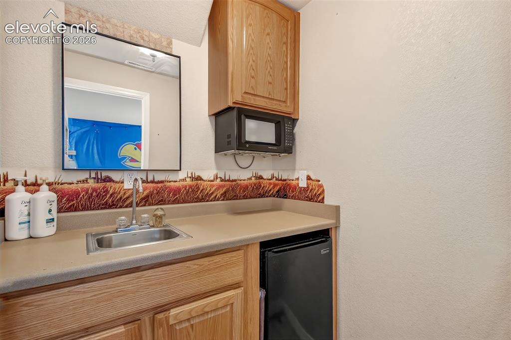 Image 21 of 26: Kitchenette in basement