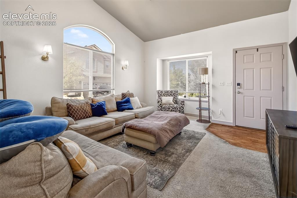 Image 5 of 26: Living room with hardwood floor