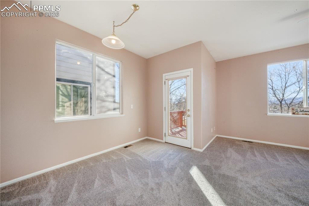 Image 12 of 50: Dining area with access to to back yard and walk out basement with all new 