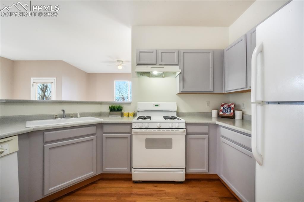 Image 17 of 50: Kitchen with gas stove and access to garage