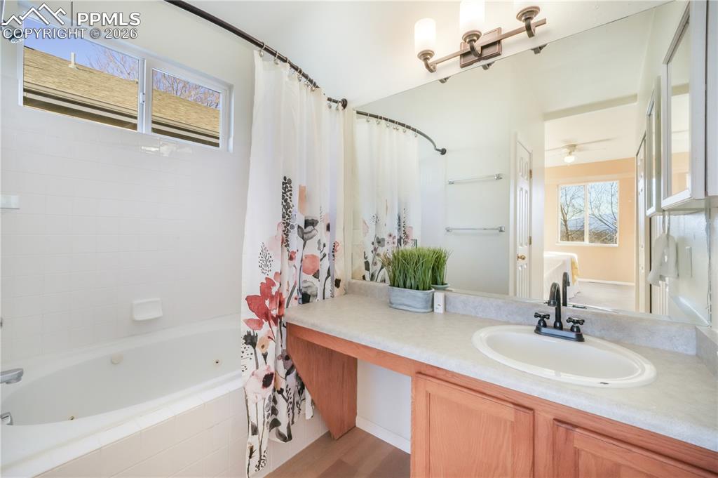 Image 25 of 50: Main floor primary bathroom with dual closets and separate water closet