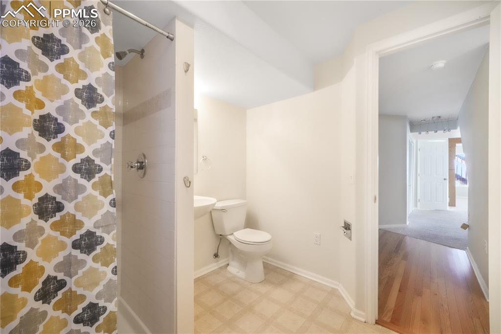 Image 40 of 50: Basement level 3/4 bathroom with large storage closet