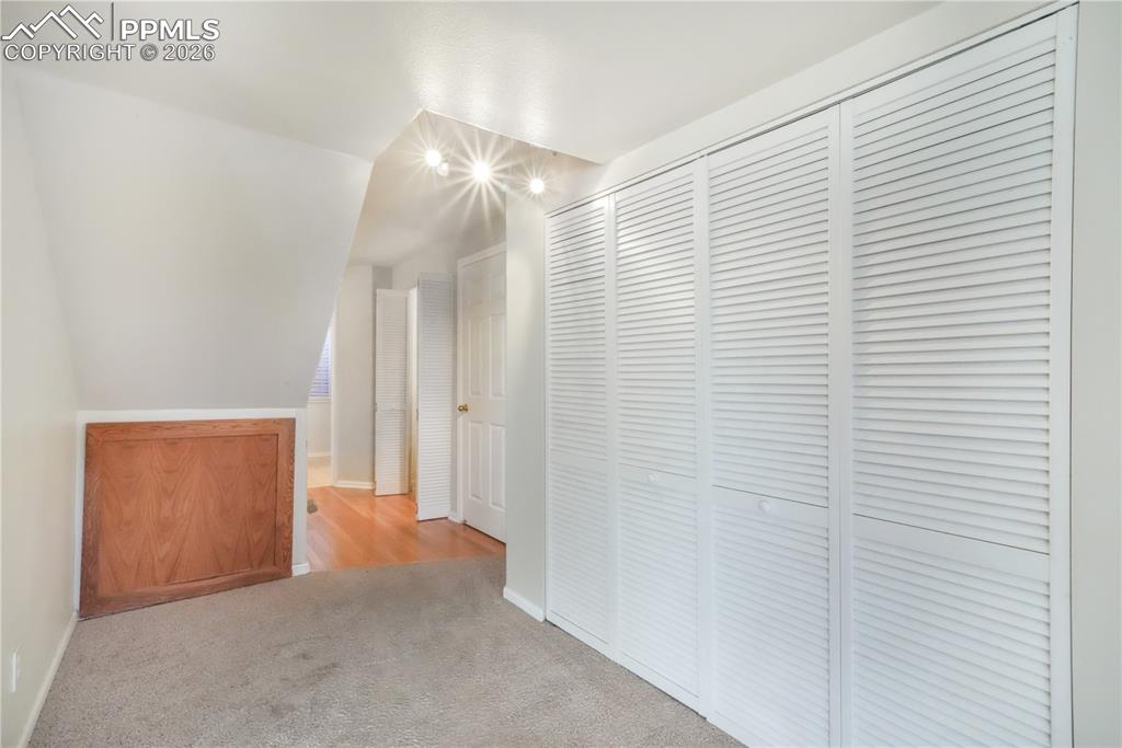 Image 42 of 50: Basement hallway with additional storage