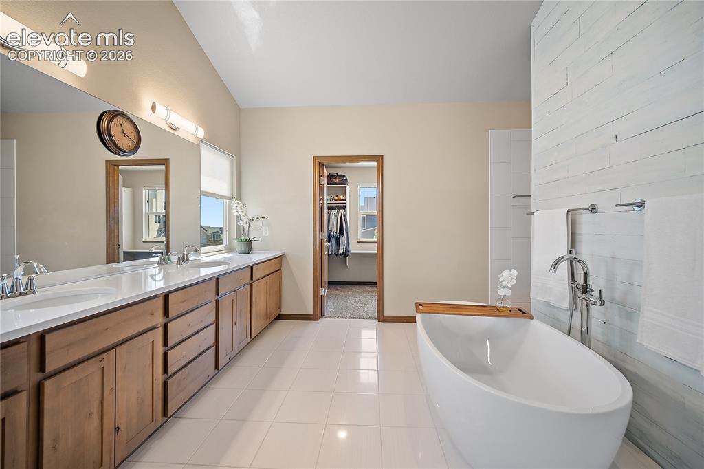 Image 15 of 44: Spa inspired primary bath. Soaking tub.