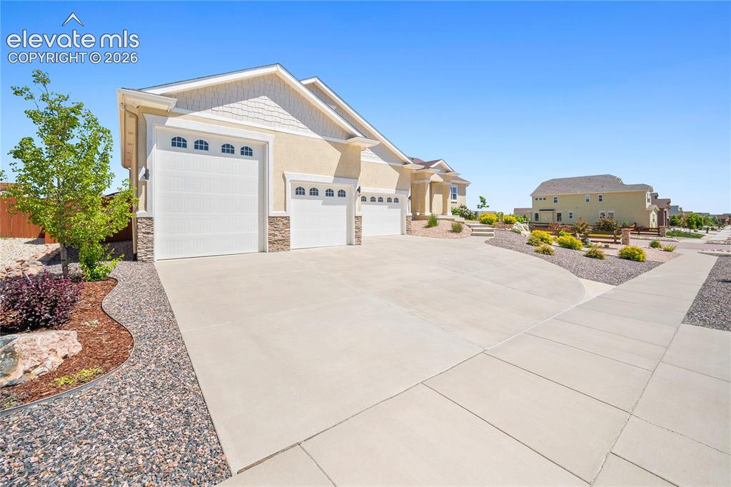 Image 2 of 44: Large corner lot. Easy to maintain landscaping.