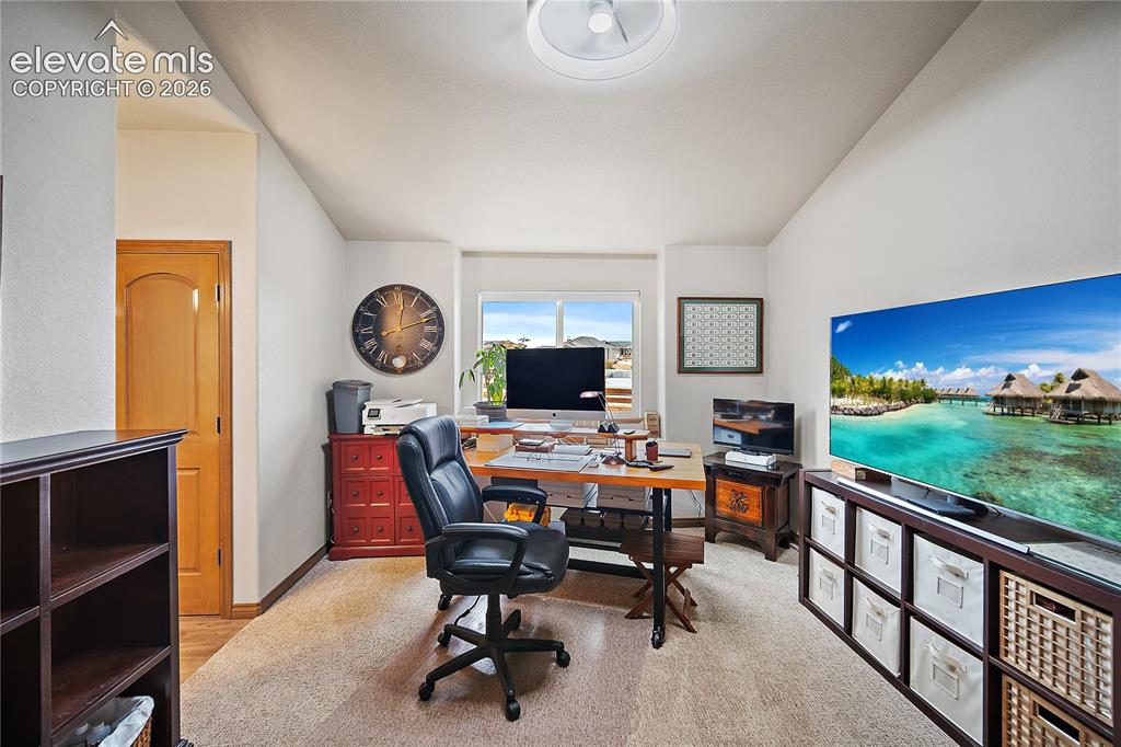 Image 21 of 44: Main level bedroom (being used as an office space) Attached Jack n Jill bat
