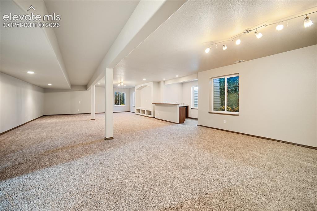 Image 25 of 44: Finished basement with endless possibilities.