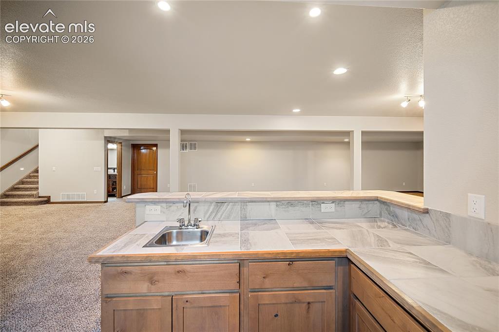 Image 28 of 44: Basement wet bar 