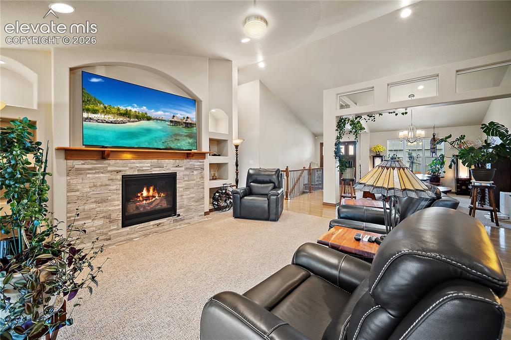 Image 7 of 44: Vaulted ceilings, NEW carpet, open concept. 