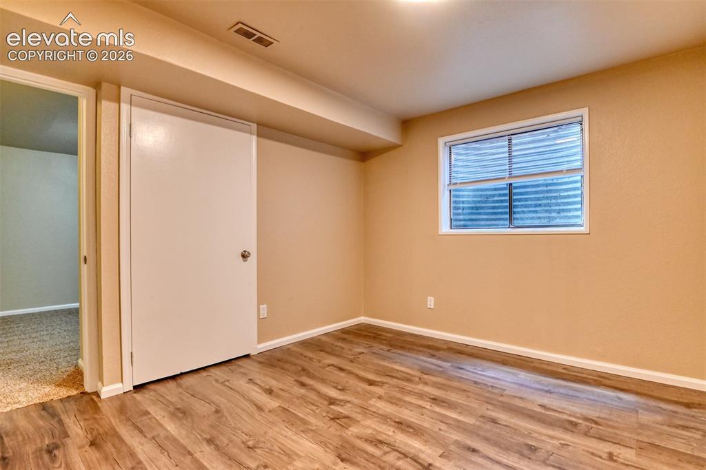 Image 41 of 50: Basement bedroom with 3/4 attached bath