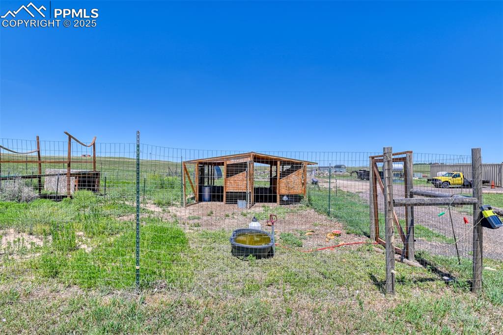 Image 31 of 47: View of yard with exterior structure and an outdoor structure