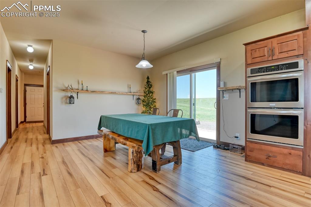 Image 8 of 47: Recreation room featuring light wood-style flooring and baseboards
