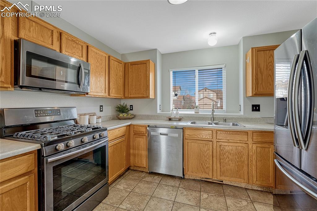 Image 7 of 47: Kitchen with gas range oven and included appliances