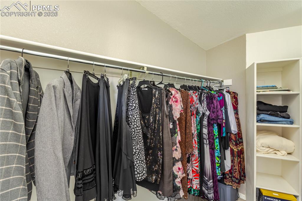 Image 38 of 50: master bedroom walk-in closet