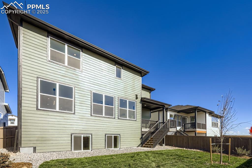 Image 27 of 28: Back of house with stairs