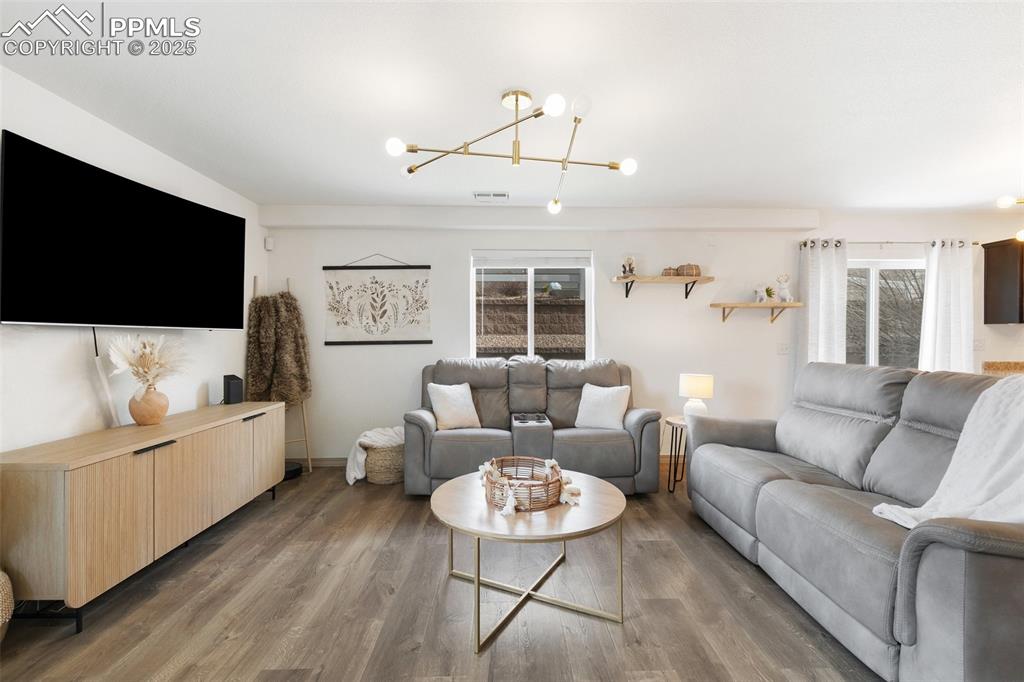 Image 2 of 17: Living Room with Luxury Vinyl
Wood