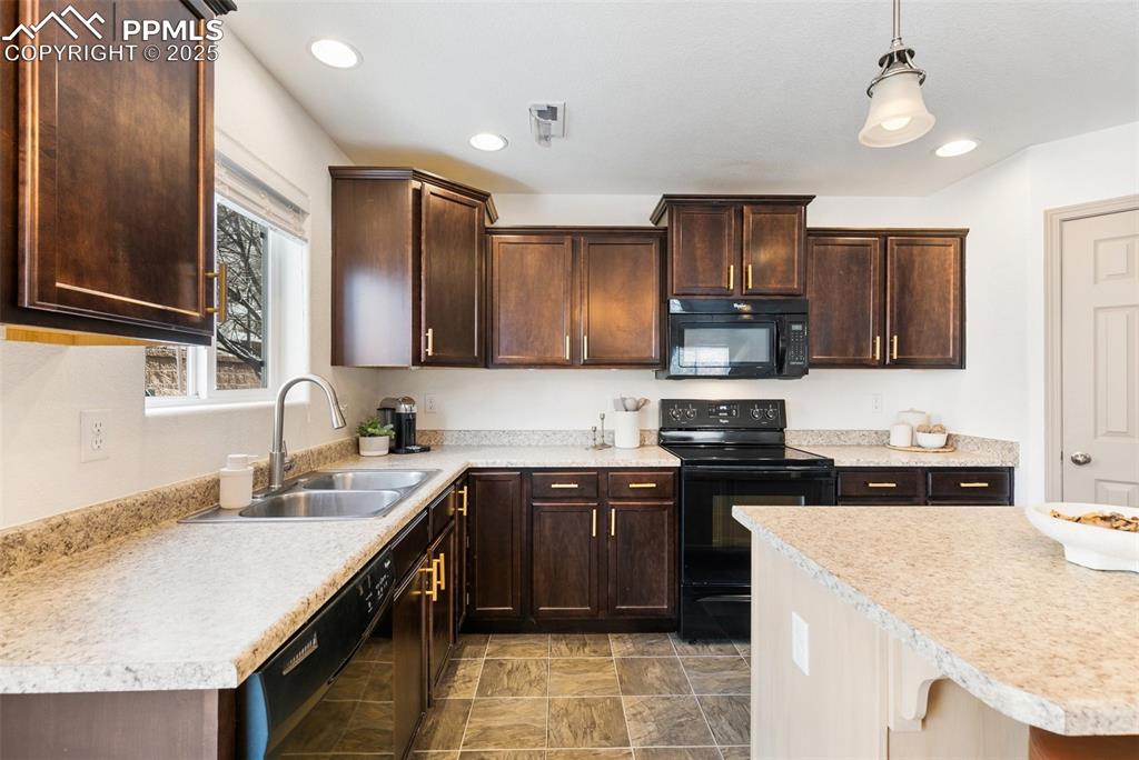 Image 7 of 17: Kitchen With Gold Hardware and
Updated Light Fixtures