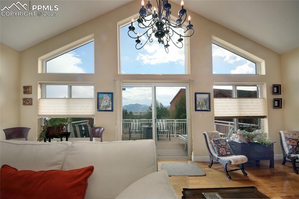Image 3 of 36: Stunning floor to ceiling windows with gorgeous view of the mountains!