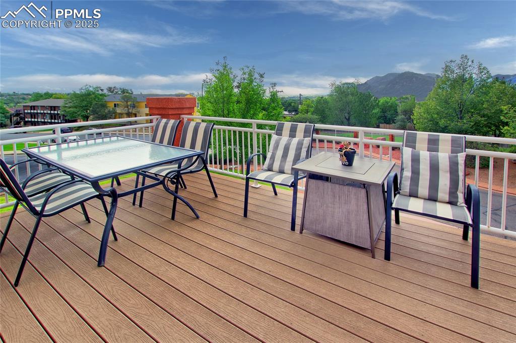 Image 31 of 36: The large, beautiful deck has gorgeous views of the mountains and nighttime