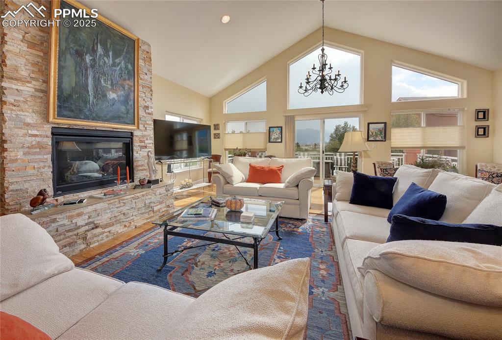 Image 4 of 36: Large living room with gas fireplace